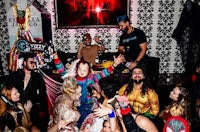 a group of people dressed up in costumes at a party
